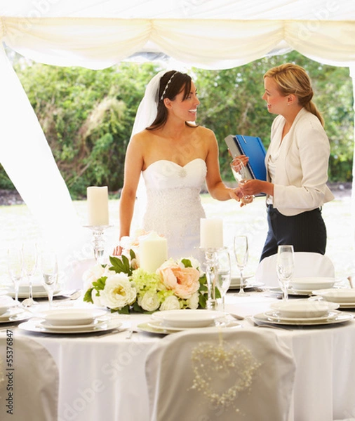 Obraz Bride With Wedding Planner In Marquee