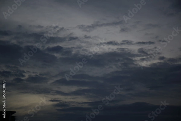 Obraz rainbow light behind the dark clouds sky backgrounds 