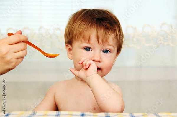 Fototapeta feeding a baby.