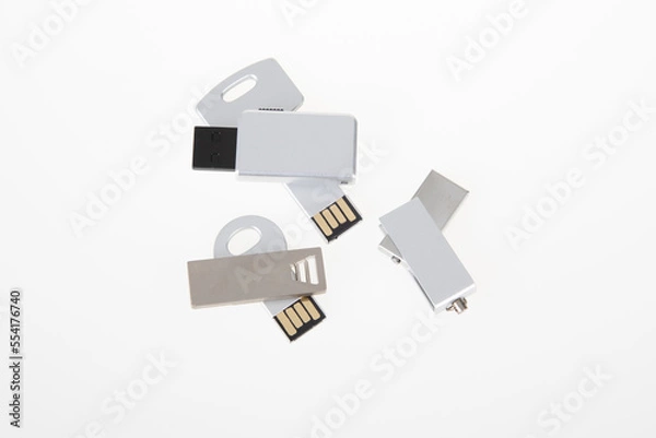 Fototapeta batch of multiple open different usb key for advertising mockup flash drive silver grey for template and mock up