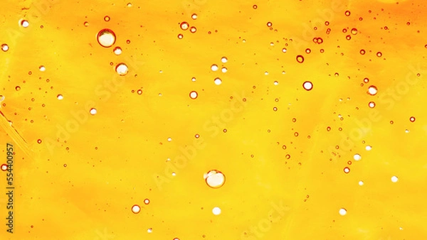 Fototapeta texture yellow golden cannabis wax, marijuana shatter resin concentrate background