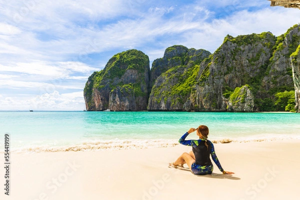 Fototapeta Young Asian lady tourist on the  the beach, Ma Ya bay, Phi Phi island  krabi province Thailand.