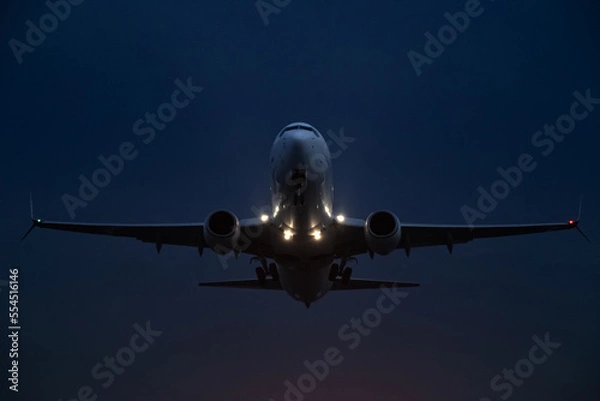Obraz passenger plane takes off at night, airfield lights