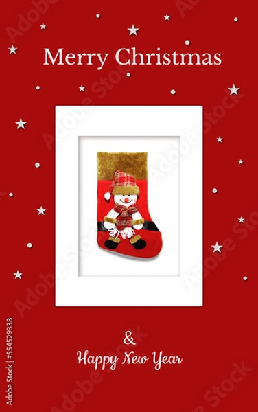 Obraz Christmas card with a red gift sock and a snowman in a red checkered hat on a red backdrop. The sock is in the white frame and there're are stars and snowflakes around. It can be used in print, web...
