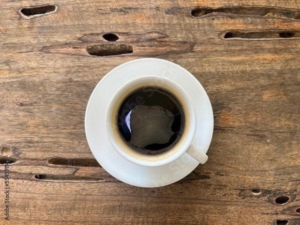 Obraz Top view, a cup of hot americano on wooden table 