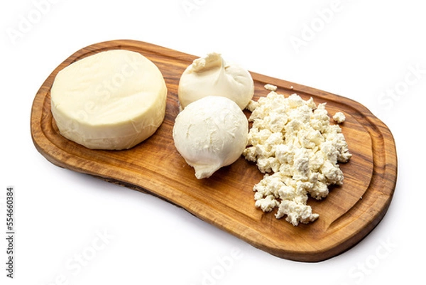 Fototapeta Assorted cheeses on a board 