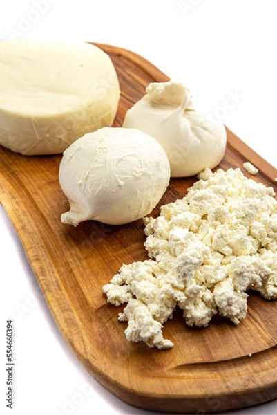 Obraz Assorted cheeses on a board 