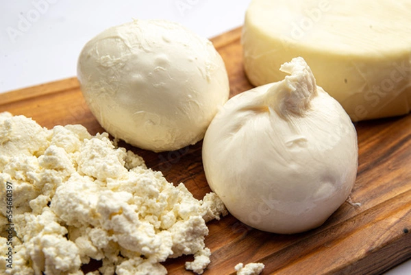 Obraz Assorted cheeses on a board 