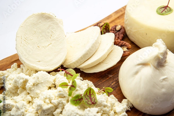 Fototapeta Assorted cheeses on a board 