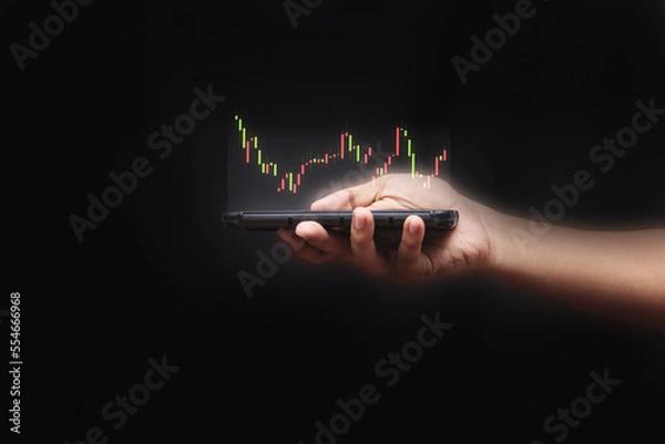 Fototapeta Businessman draw growth graph and progress of business and analyzing financial and investment data