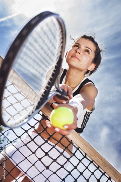 Obraz Beautiful young girl rests on a tennis net