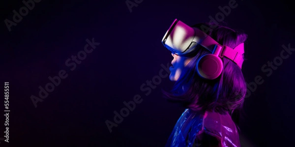 Fototapeta Woman in virtual reality goggle in neon colors.