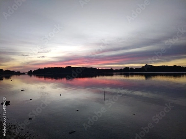 Fototapeta sunset over the river