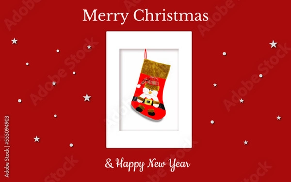 Obraz Christmas card with a red gift sock and Santa in a red checkered hat on a red backdrop. The sock is in the white frame. There are also white stars,  snowflakes and christmas inscriptions. JPG file.