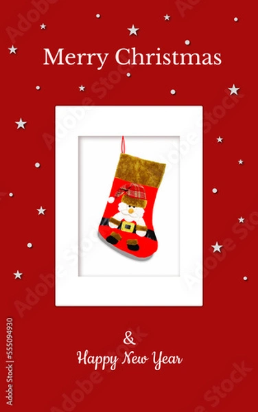 Obraz Christmas card with a red gift sock and Santa in a red checkered hat on a red backdrop. The sock is in the white frame. There are also white stars, snowflakes and Christmas inscriptions. JPG file.