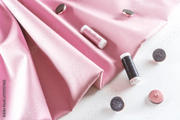 Fototapeta pink fabric, buttons and spools of thread