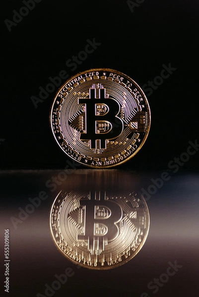 Obraz golden bitcoin coin with black background