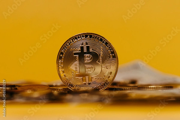 Obraz golden bitcoin coin with yellow background