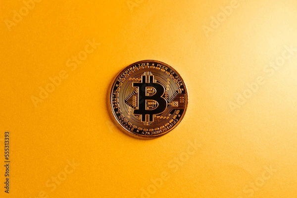 Fototapeta golden bitcoin coin with yellow background