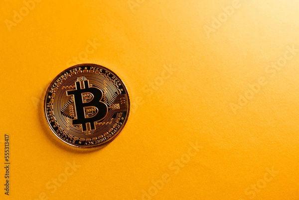 Fototapeta golden bitcoin coin with yellow background