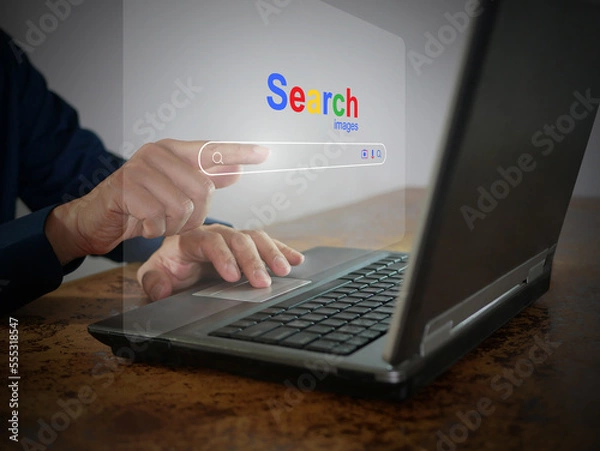 Fototapeta A man is using a notebook computer to searching for information. A virtual screen of the Search website browser for finding data on the internet. Global network, search engine optimization technology