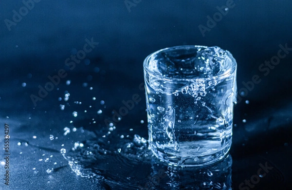 Fototapeta drinking clean water in a transparent glass