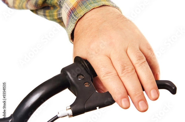 Fototapeta man's hand on the handlebars.