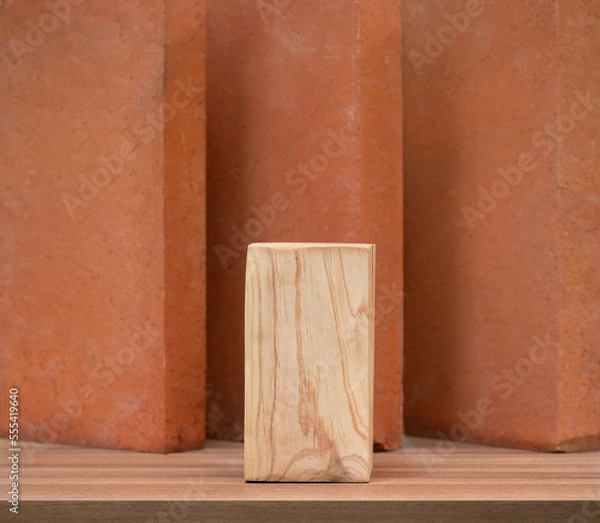 Fototapeta empty beige wood podium on tabletop with brown brick block wall background with space.organic healthy natural cosmetic product present show promotion stand display backdrop design.