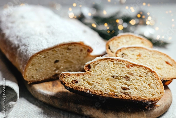 Fototapeta Christmas stollen on a gray background with highlights.