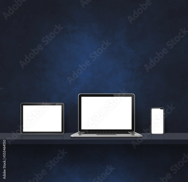 Fototapeta Laptop, mobile phone and digital tablet pc on black wall shelf. Square background