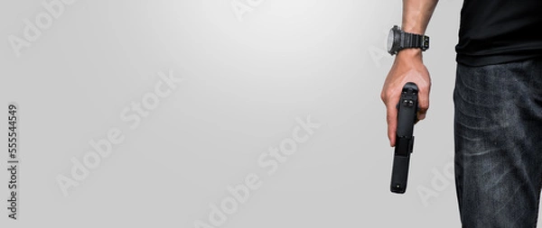 Fototapeta Isolated 9mm pistol gun holding in right hand of gun shooter with clipping paths, copy space.