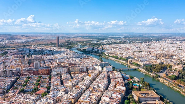 Fototapeta Aerial view of the Spanish city of Seville in the Andalusia region on the river Guadaquivir overlooking the cathedral