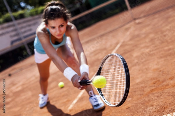 Obraz Beautiful girl smiling with a tennis racket