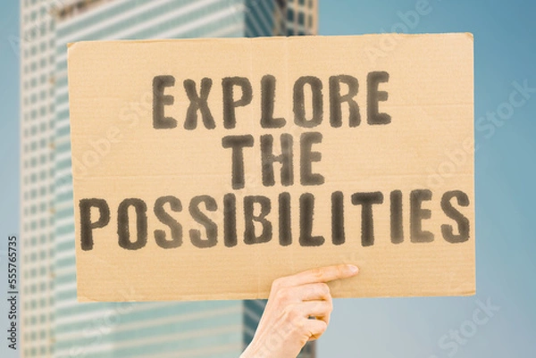 Fototapeta The phrase " Explore the Possibilities " is on a banner in men's hands with blurred background. Career. Direction. Motivation. Chance. Idea. Opportunity. Way. Choice. Decision. Different. Guide. Job