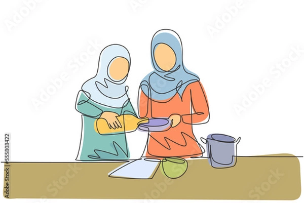 Fototapeta Single continuous line drawing Arabian mother and daughter pour oil into pan which is being held by one of them. Cooking preparation in cozy kitchen. One line draw graphic design vector illustration