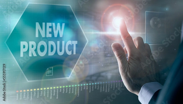 Fototapeta A businessman controlling a futuristic display with a New Product business concept on it.