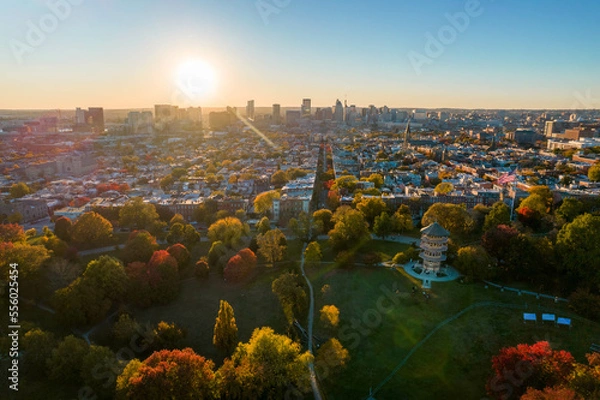 Fototapeta Aerial Drone View of Patterson Park in Baltimore City in Fall at Sunset with the City Skyline in the Distance