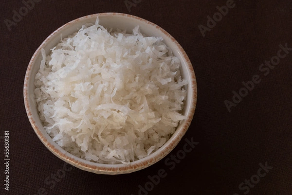 Fototapeta Sweetened Shredded Coconut in a Bowl