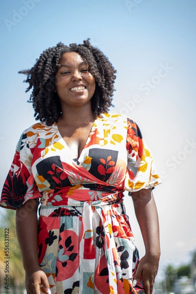 Fototapeta Natural Black Woman basking in the sun enjoying the water.
