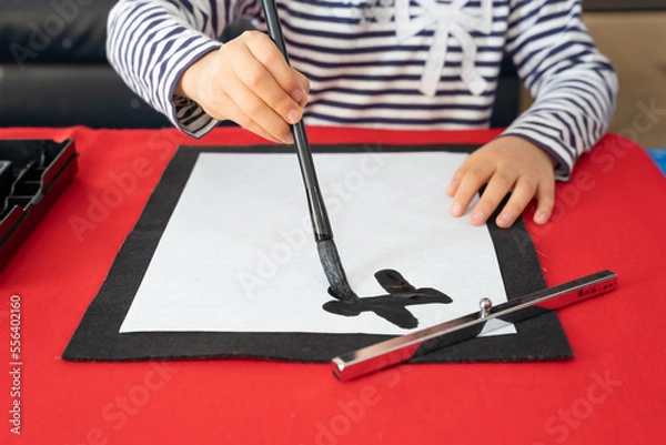 Obraz 習字をする子供