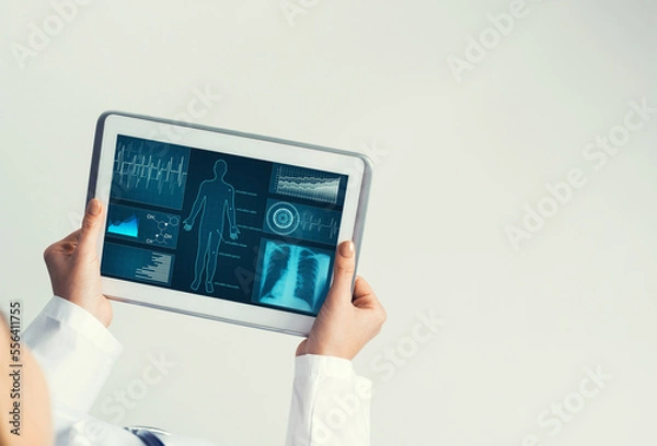 Fototapeta Close of female doctor hands working with tablet pc computer