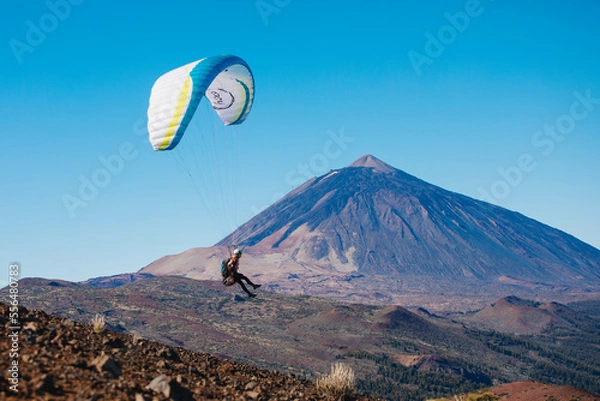 Obraz Paragliding in Tenerife from the volcano through the clouds. Teide