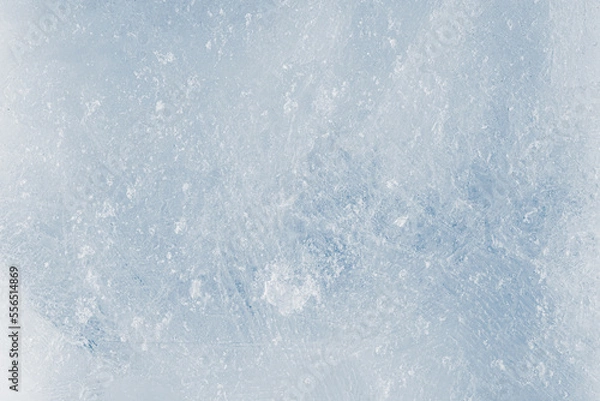 Fototapeta Rough ice texture, light blue tones background. The textured cold frosty surface of the ice.