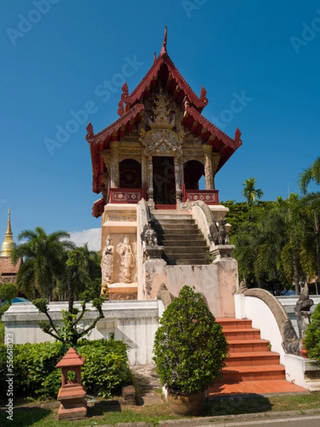 Fototapeta Hall of Phra Tripitaka temple inside Wat Phra Singh Woramahawihan Buddhist Temple. It is one of the most popular tourist destinations in Chiang Mai City. Thailand