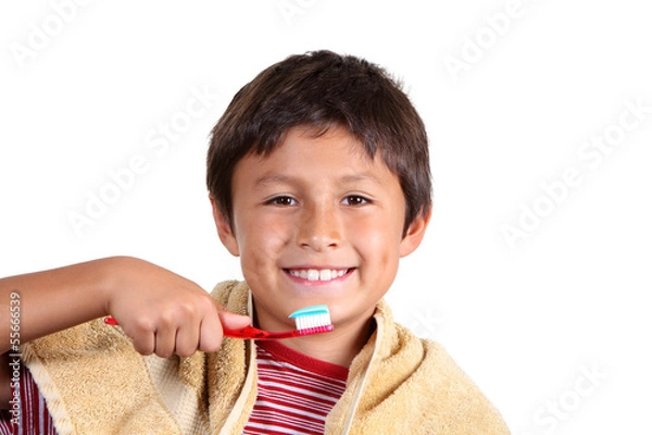 Obraz Young boy brushing teeth on white background