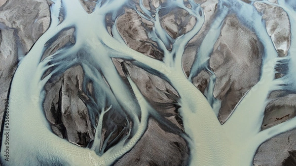 Fototapeta Glacial rivers from above. Aerial photograph of the river streams from Icelandic glaciers. Beautiful art of the Mother nature created in Iceland. Wallpaper background 