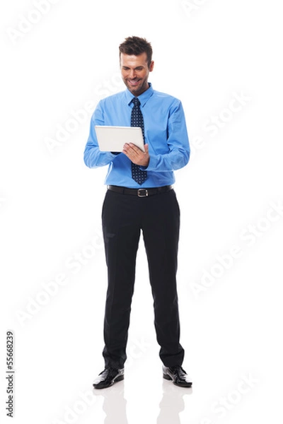 Fototapeta Man checking something on his tablet