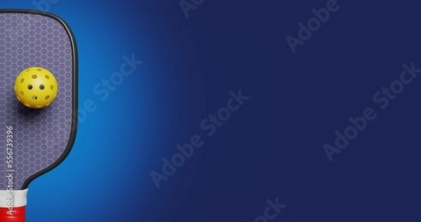 Obraz Part of a paddle racket and a plastic ball with holes for playing pickleball on a blue background. American sports 3D rendering