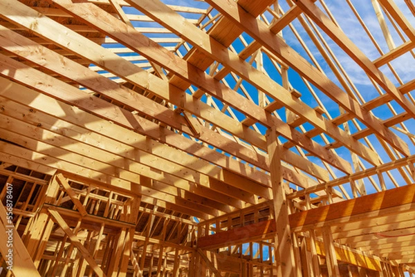 Obraz A house is being constructed with framing beams.