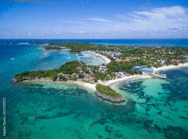 Fototapeta Sunny Day in Malapascua Island in Visayan Sea, One of Cebu Island. Sea water and Boats. Bounty Beach with Local Architecture